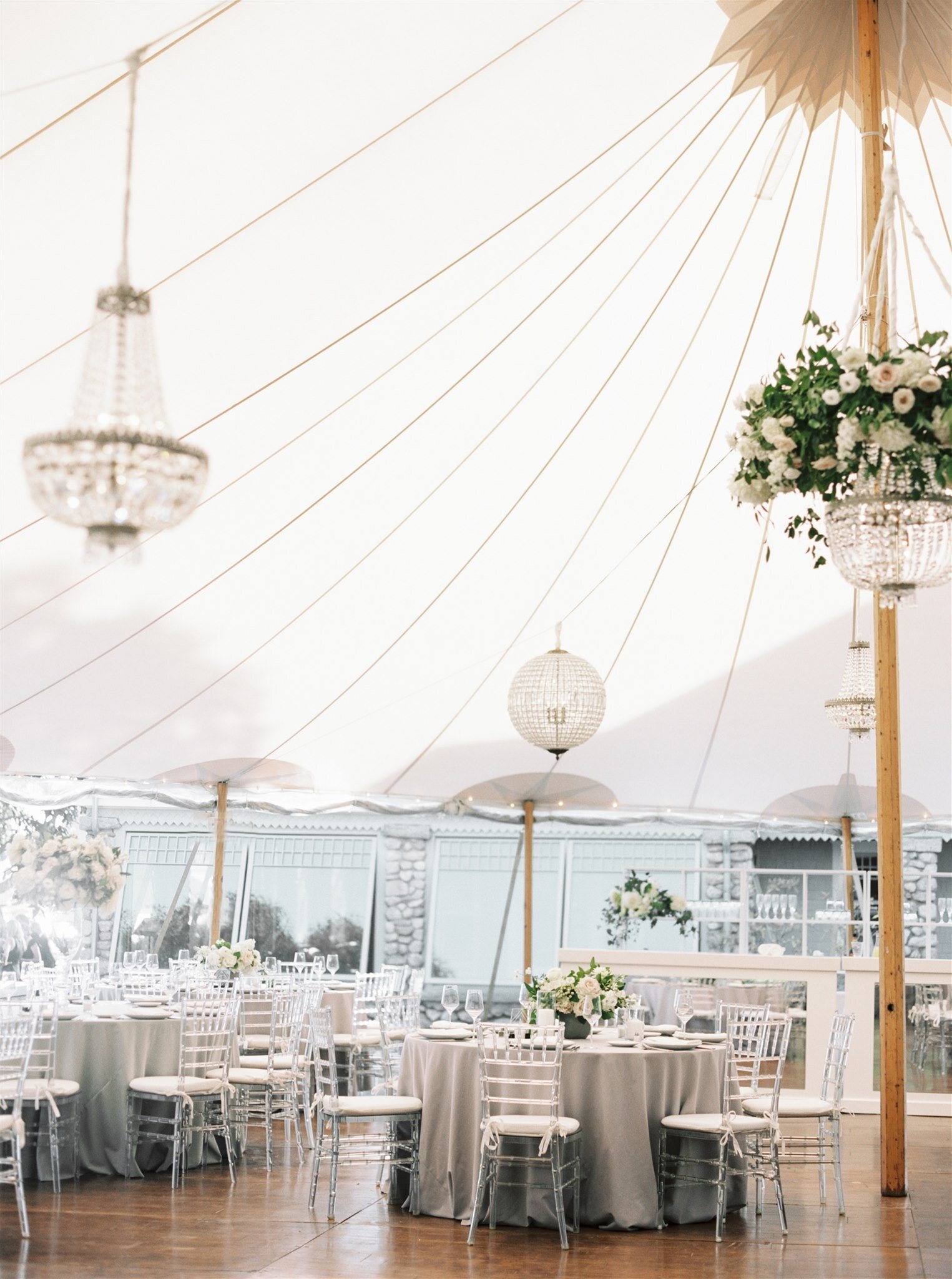  This wedding had mostly round tables to maximize seating and floral budget in the tent Floral by The Wild Dahlia | Photography by Elizabeth Laduca 